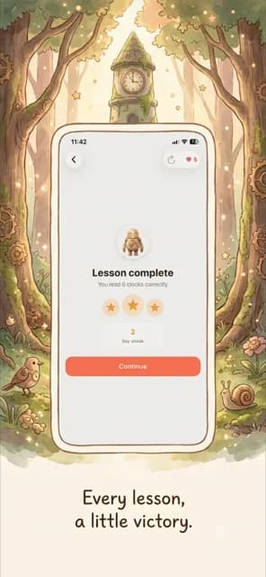 Lesson complete screen with a three-star rating, illustrated in a celebratory forest clearing